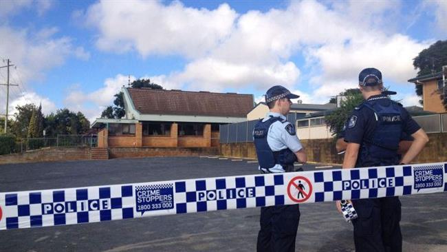 The photo shows Australian police officers standing outside the mosque in Toowoomba.