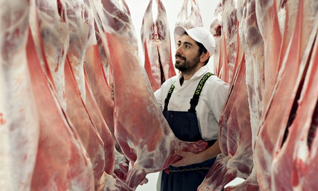 A butcher in an abattoir.